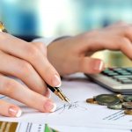 Girl signing a document