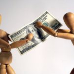 Figures holding money