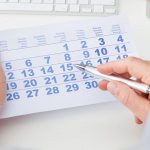 Calendar and men&#39;s hands