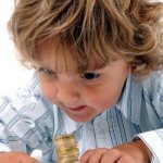 Child and coins