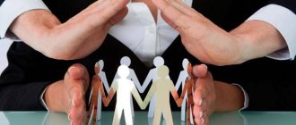 Hands of a man and woman protecting paper people